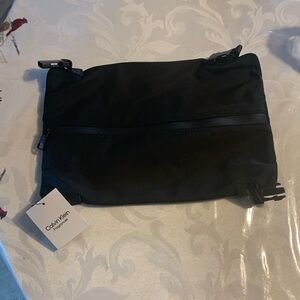 Cute Calvin Klein makeup or travel bag.